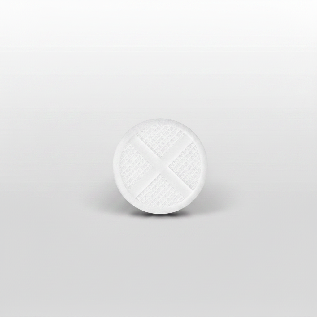 A close-up shot of a white circular shower head filter cartridge with a cross-shaped textured design, centered on a light gray gradient background.